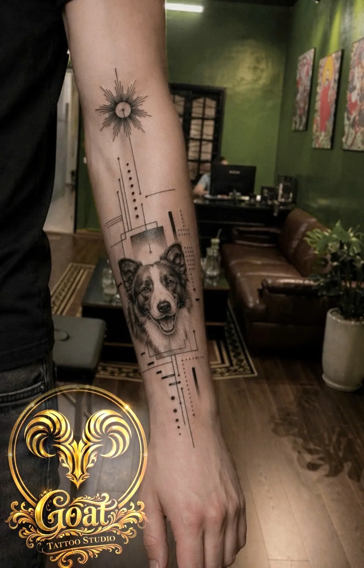 Realistic border collie portrait tattoo with geometric linework on the forearm, by GOAT Tattoo Studio in Hanoi.