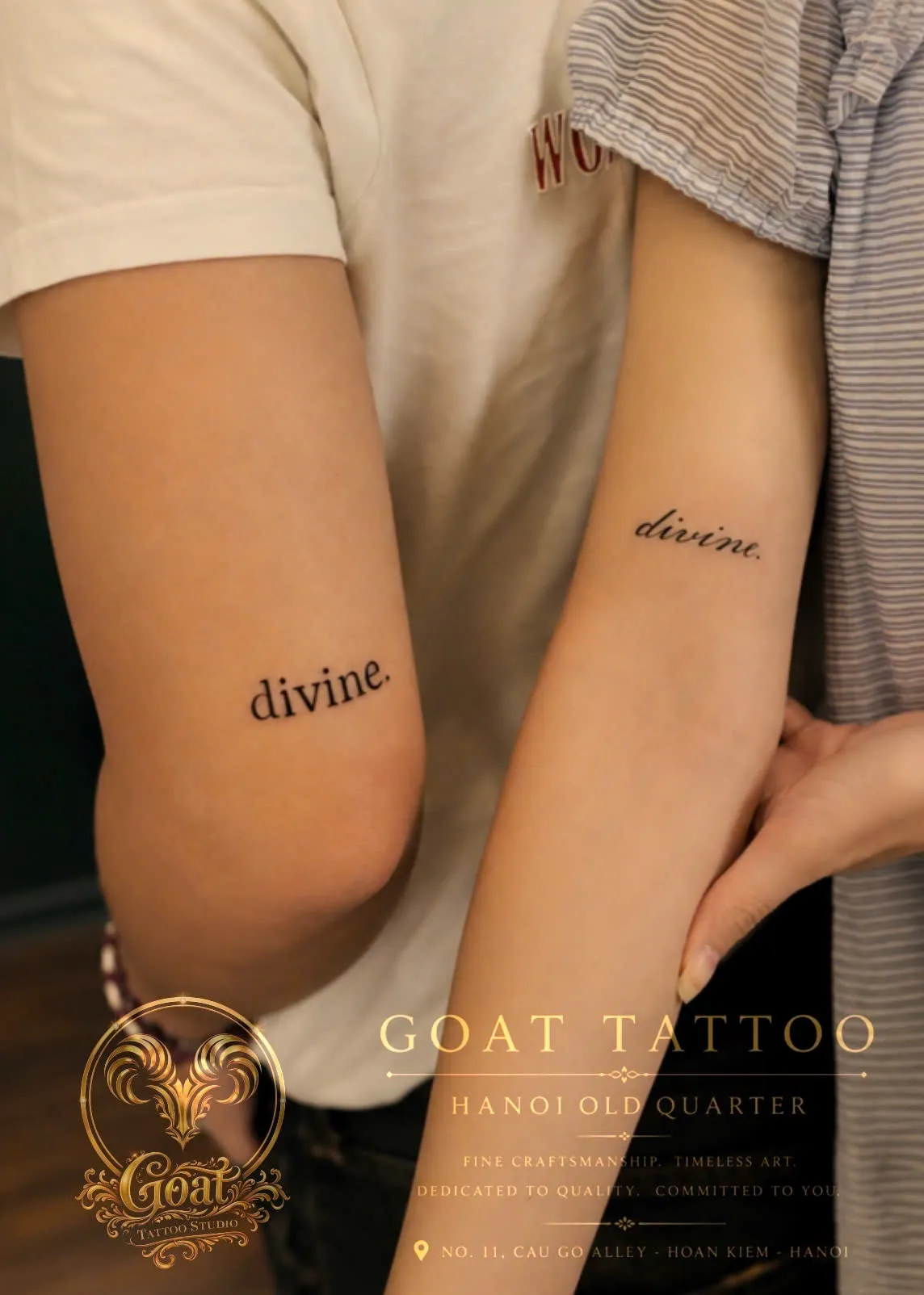 A minimalist script lettering tattoo reading "divine." inked on the inner forearms of a couple, done at GOAT Tattoo Studio in Hanoi's Old Quarter.