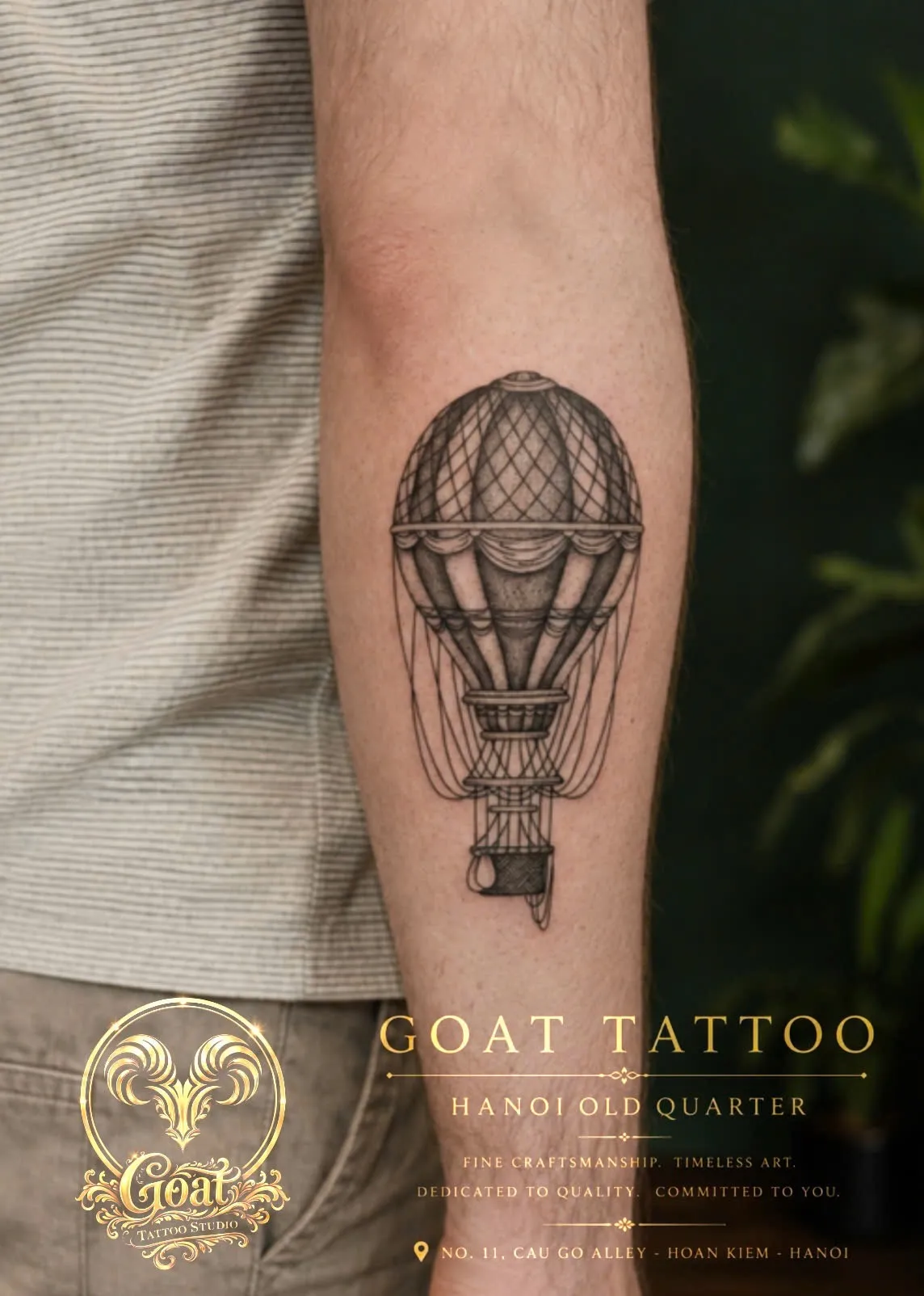 Fine line illustrative hot air balloon tattoo with basket detail on the forearm, by GOAT Tattoo Studio in Hanoi.