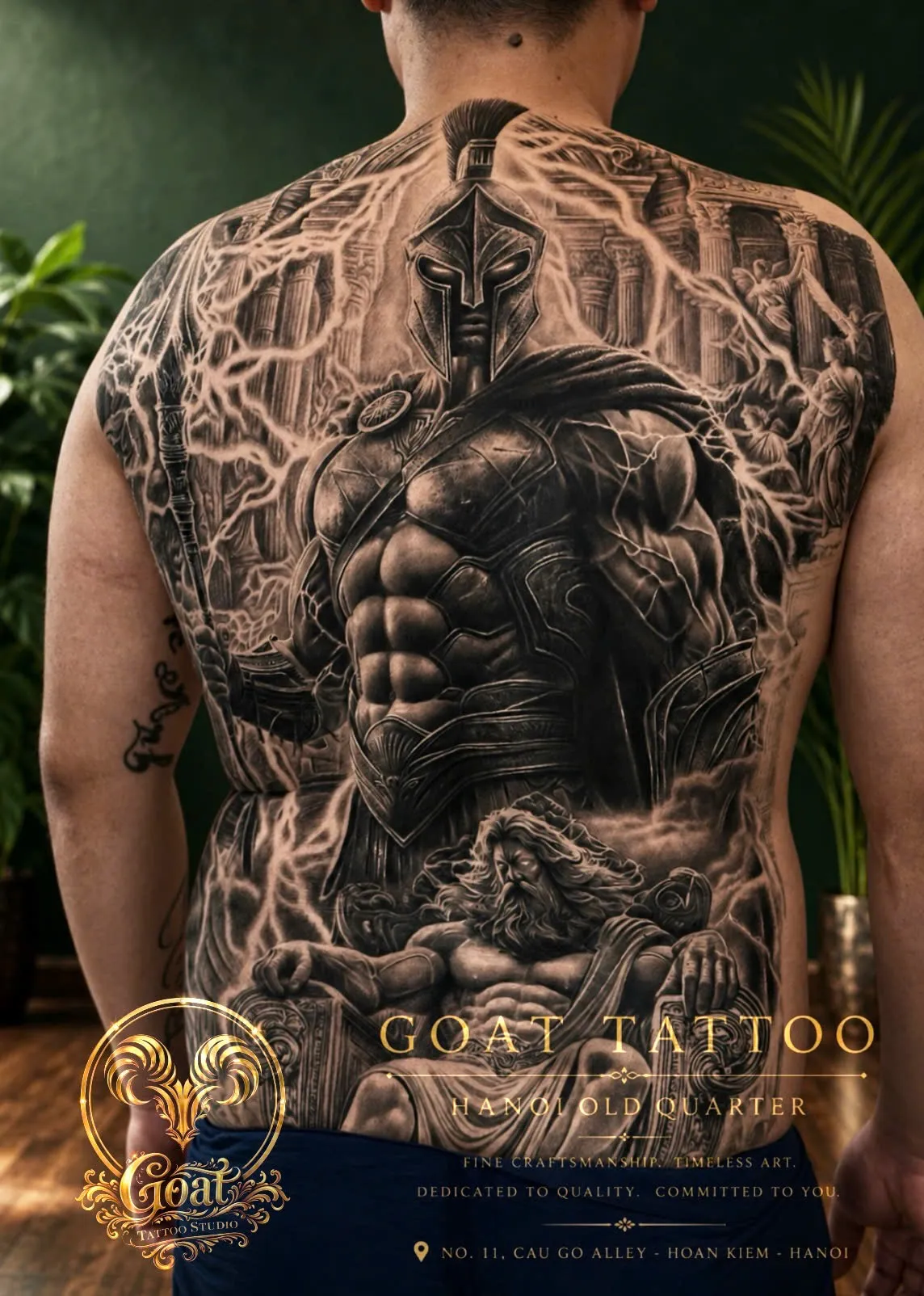 Black and grey realism tattoo of a Spartan warrior and Greek mythology scene covering the full back, GOAT Tattoo Studio Hanoi.