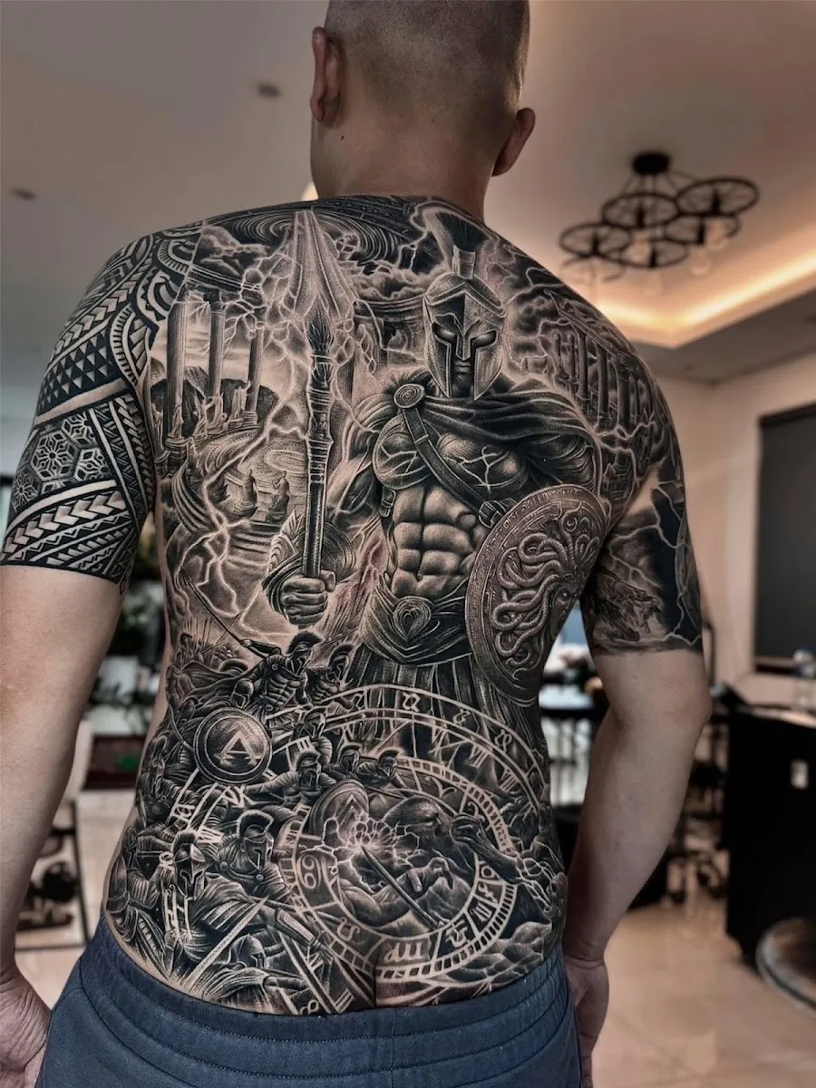 Black and grey Spartan warrior full back tattoo, photo shared by the reviewer